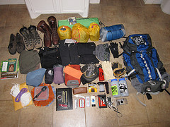 Hiking gear unpacked on the floor